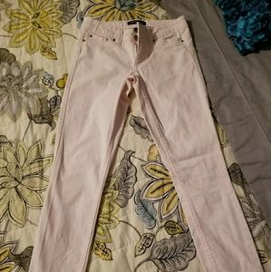 Pale pink skinny jeans